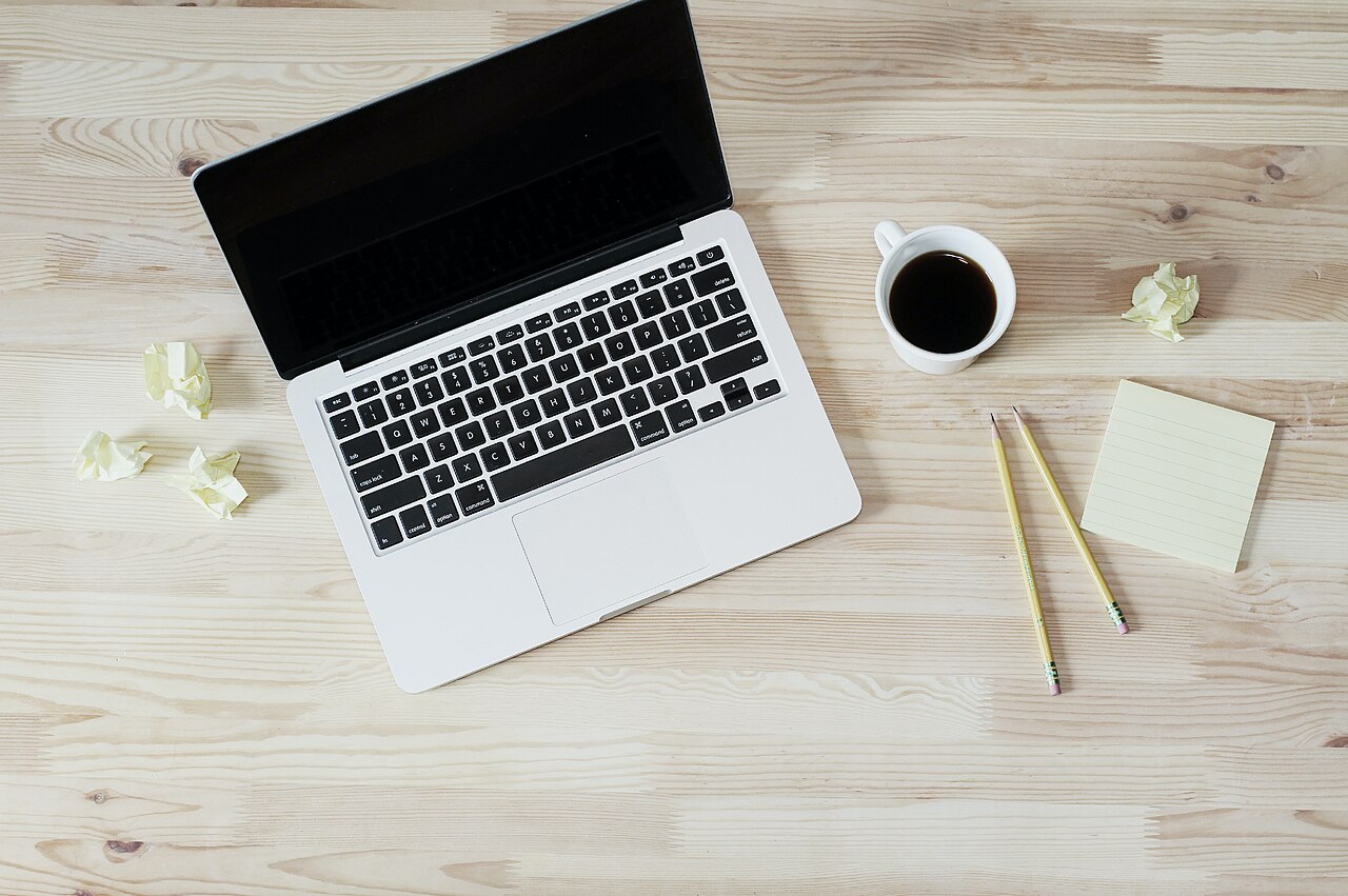 Laptop and coffee on a desk