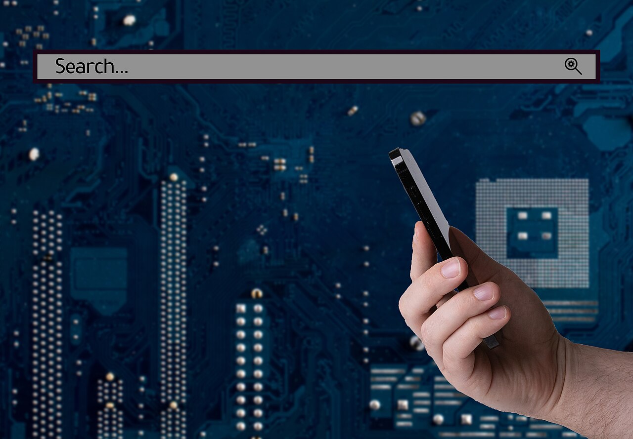 Business and technology concept hand holding smartphone